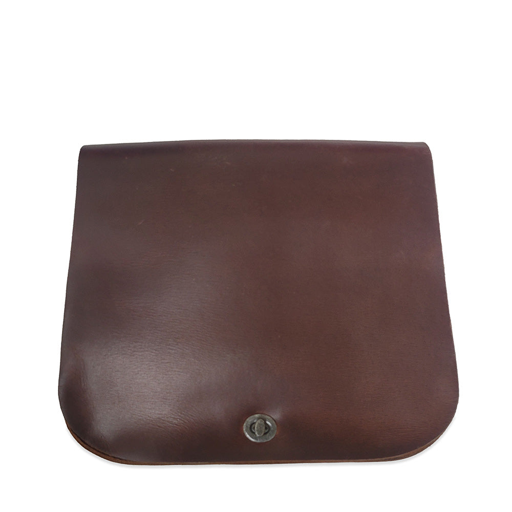 Brown leather saddlebag on a white background