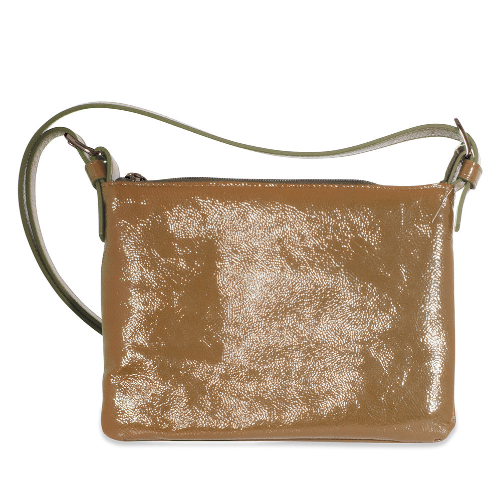 Cream leather handbag with a textured surface on a white background