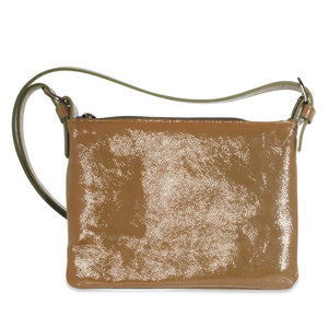 Cream leather handbag with a textured surface on a white background