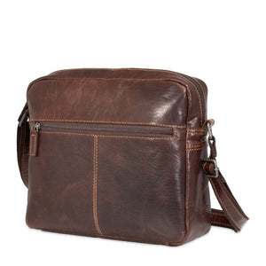 Brown leather shoulder bag on a white background
