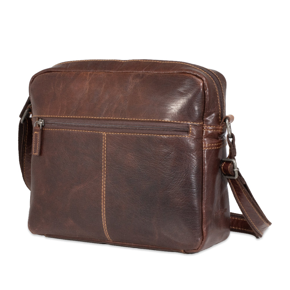 Brown leather shoulder bag on a white background