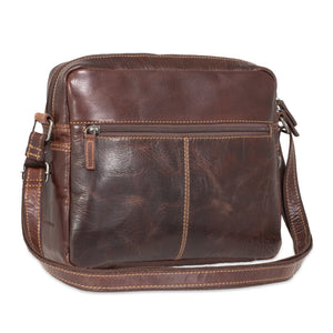 Brown leather shoulder bag on a white background