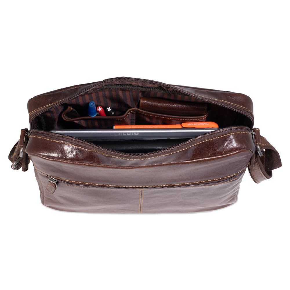 Brown leather bag with compartments on a white background
