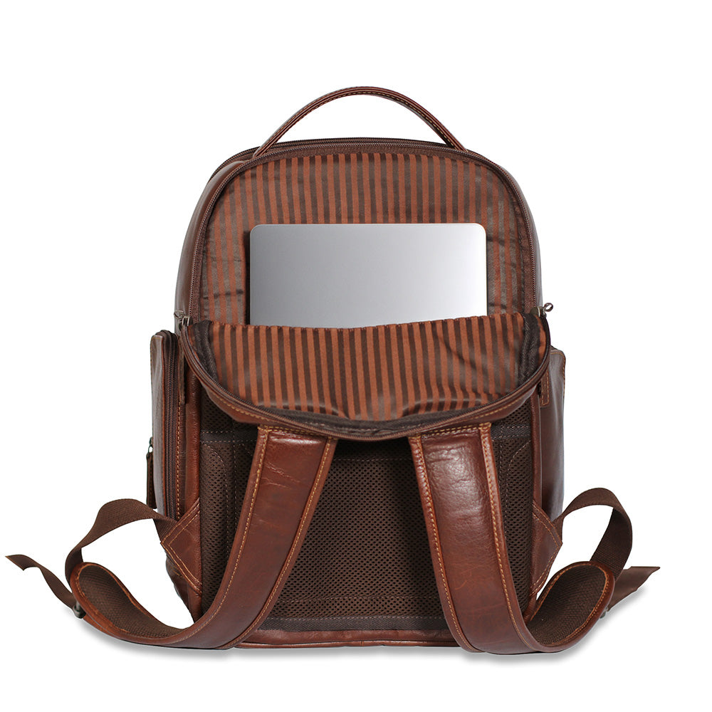 A brown leather backpack shown open against a white background, with a striped interior lining and a mirror attached inside the top compartment.