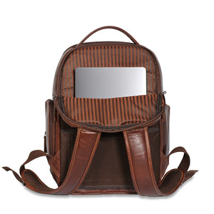 A brown leather backpack shown open against a white background, with a striped interior lining and a mirror attached inside the top compartment.