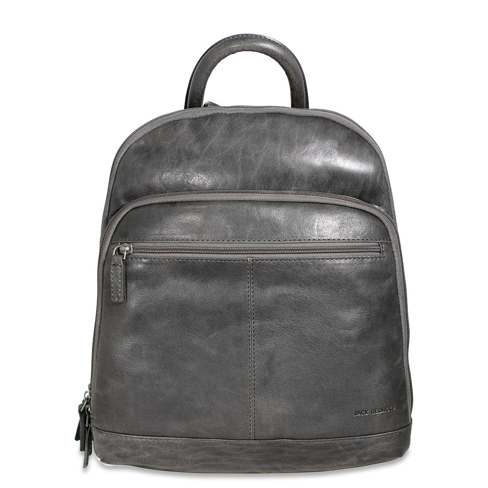 A brown, hand-stained buffalo leather small backpack with a zipper closure, front zip pocket, and adjustable shoulder straps.
