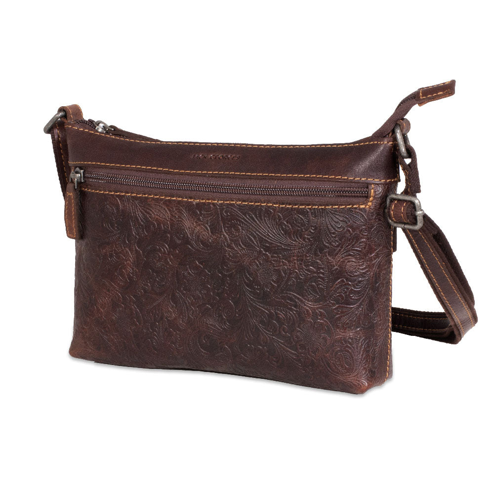 Brown leather handbag with floral embossing on a white background