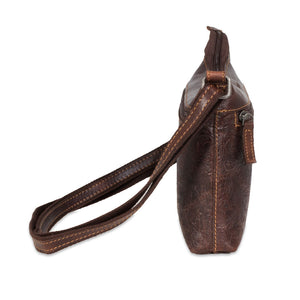 Brown leather crossbody bag on a white background