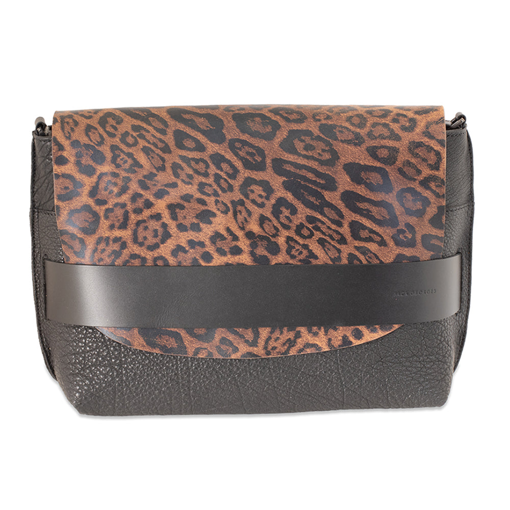 Handbag with leopard print top section and black bottom section on a white background