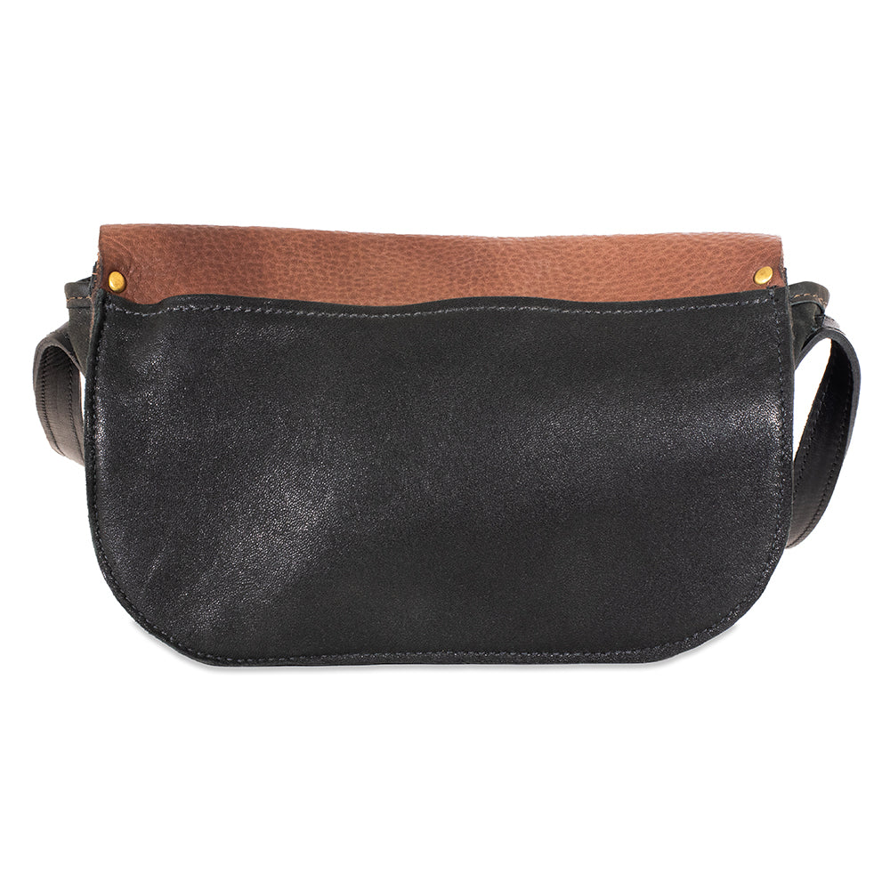 Black leather crossbody bag with brown top section on a white background