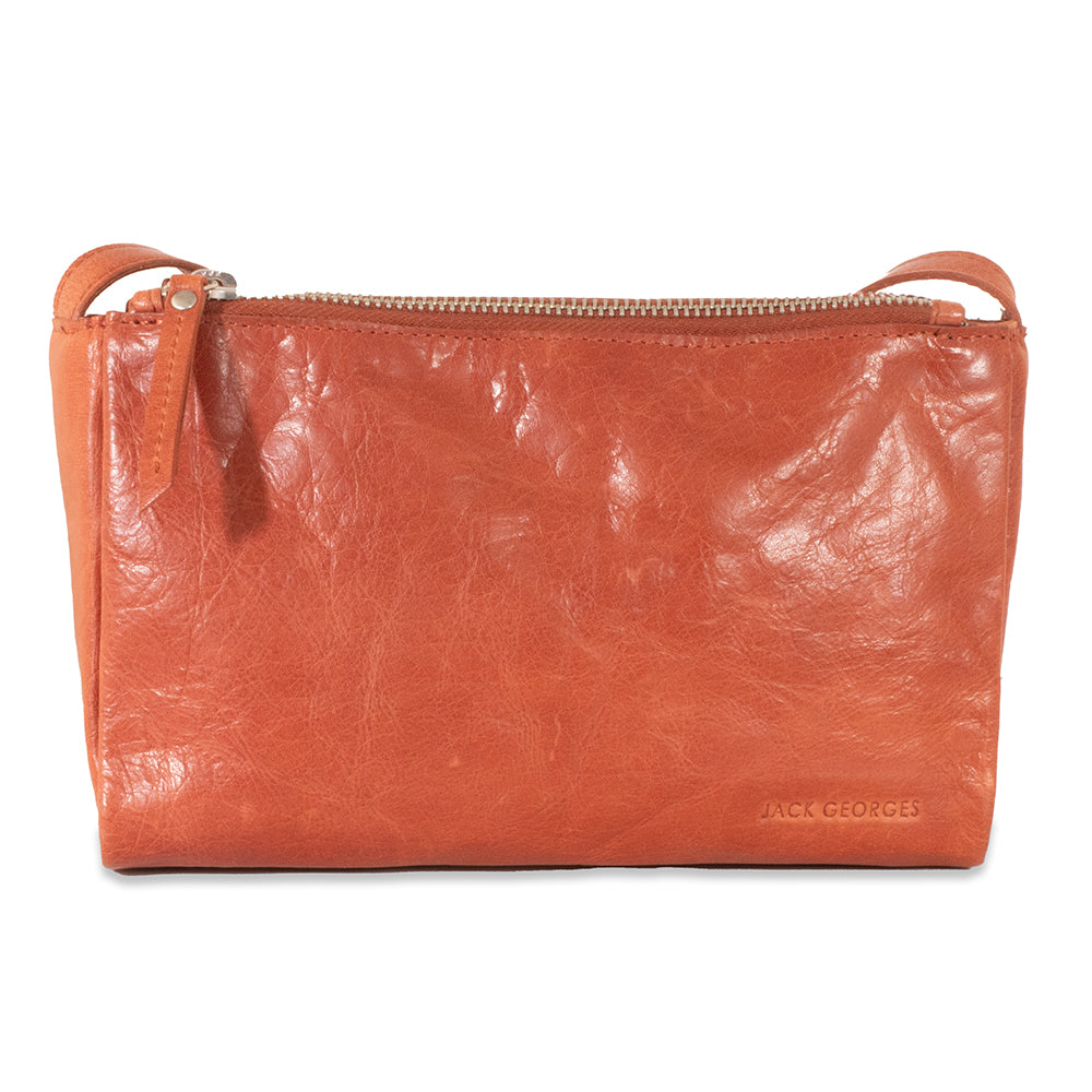 Orange leather pouch with a visible brand name on a white background
