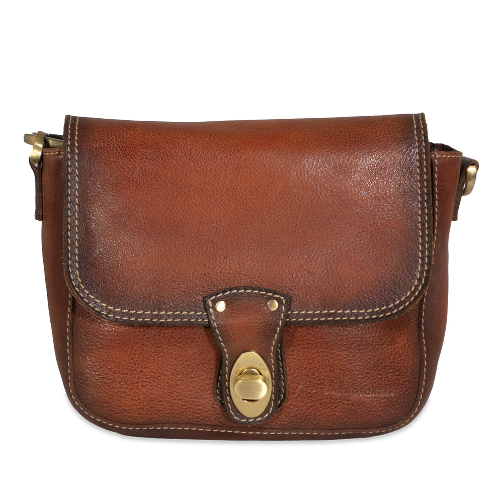 Brown leather bag with gold buckle on a white background