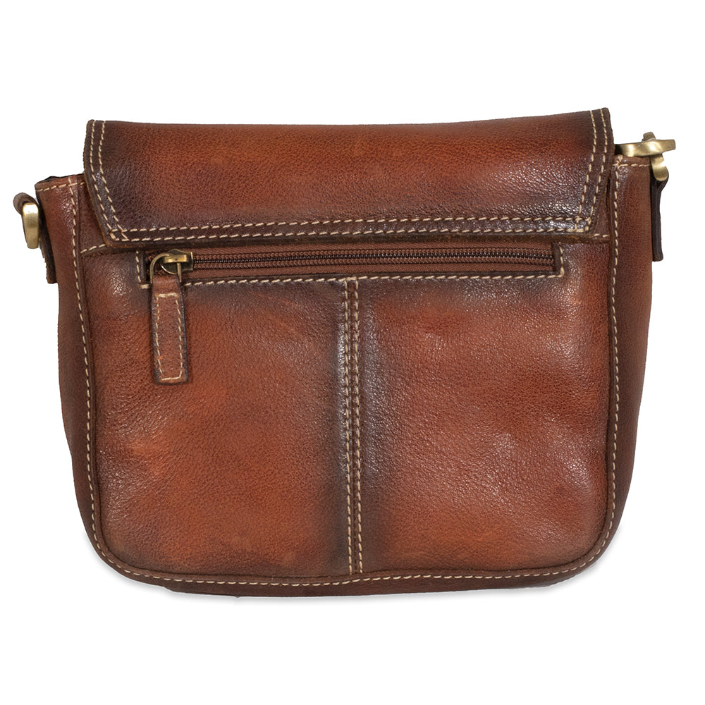 Brown leather handbag with gold zipper and hardware on a white background