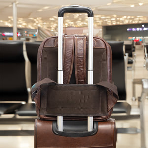 Brown suitcase with wheels in an airport setting